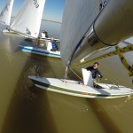 View from end of the boom of Laser sailing downwind